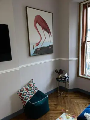 a living room with a picture of a flamingo on the wall at Stunning 1 bed Apt in West End in Glasgow