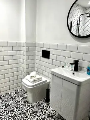 a white bathroom with a toilet and a sink at Stunning 1 bed Apt in West End in Glasgow