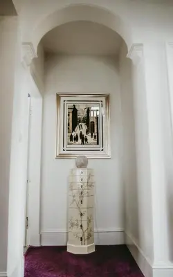 a white room with a picture on the wall at Dawn Break Guest House in Largs
