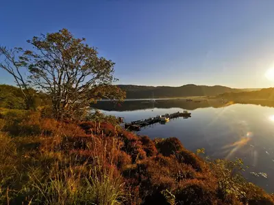 a view of a lake with a boat in the water at Kelpie in Lochgilphead