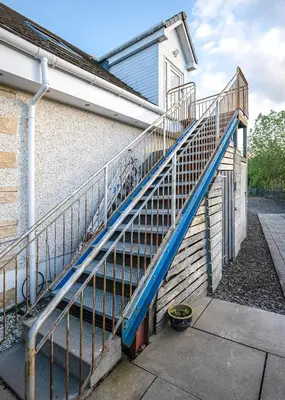 a set of stairs leading up to a house at Castle View - Home from Home in Stirling