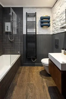 a bathroom with a tub and a toilet and a sink at Roselea Cottage in Luss