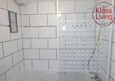 a bathroom with a shower with a tub at Mossend Apartment by Klass Living Bellshill in Mossend