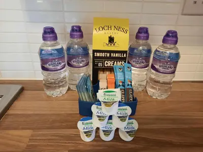 a bottle of water and a bunch of bottles of water at Pond View Upper in Airdrie