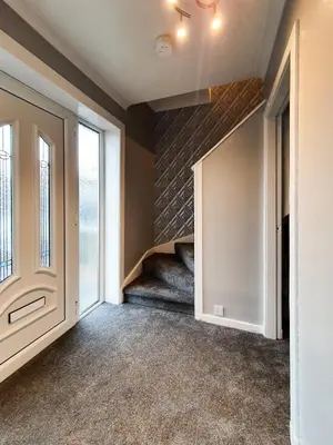 an empty hallway with a staircase in a house at 3 bedroom house Amazon M90 Dunfermline Edinburgh in Fife