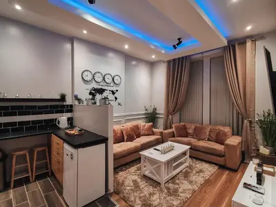a living room with a couch and a table at 3 bed apartment in the heart of westend of Glasgow in Glasgow