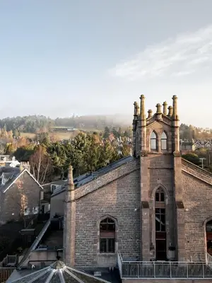 an old brick building with chimneys on top of it at The Church Tower in Crieff