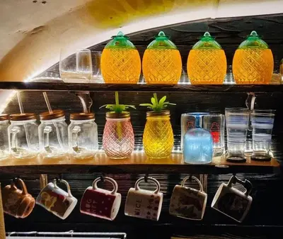 a shelf filled with different colored glass jars at Ayrshire Airstream in Galston