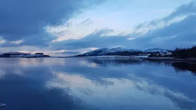 a large body of water with snow covered mountains at The Old Ferryhouse in Port Appin