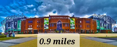 a large building with a sign in front of it at Beautiful 2bed house with garden, walking distance to town - FREE parking in Glasgow