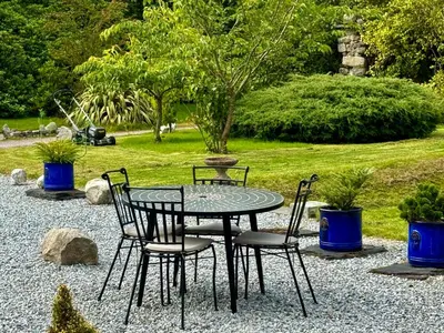 a table and four chairs sitting around a table at Ballachulish House Apartment in Ballachulish