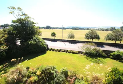 an aerial view of a garden with trees and a field at Beautiful 2 to 3 bed apartment with stunning views! in Ayr