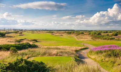 a view of a golf course with a dirt road at Beautiful 2 to 3 bed apartment with stunning views! in Ayr