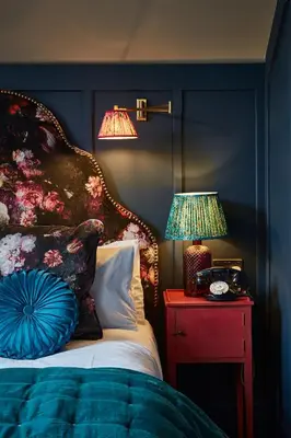 a bedroom with a bed and two lamps on a table at No17 The Promenade in Oban