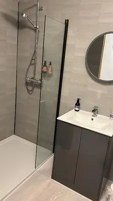 a bathroom with a shower and a sink at Lochaline Hotel in Lochaline