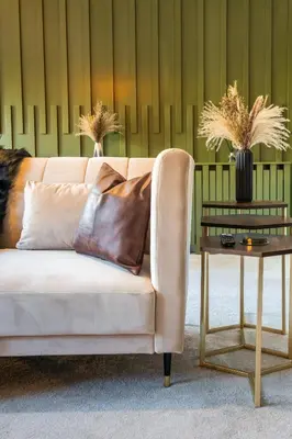 a couch in a living room with a table at The Arran Suite - Your Stylish Scottish Getaway! in Glasgow