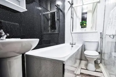 a bathroom with a sink and a toilet and a bath tub at Glasgow Southside: Cosy 2 Bedroom Apartment in Glasgow