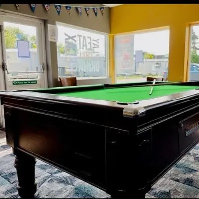 a pool table sitting in a room with at Carnoustie 24 - Turnberry Holiday Park - short walk to beach in Girvan