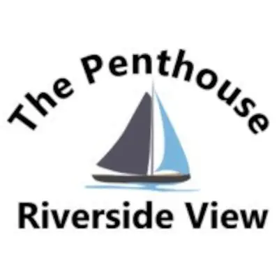 a sail boat in the middle of the water at Riverside View Penthouse in Balloch, Loch Lomond in Balloch