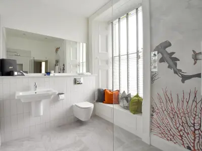 a bathroom with a sink and a toilet and a shower at The Meadowpark Bar, Kitchen & Rooms in Stirling