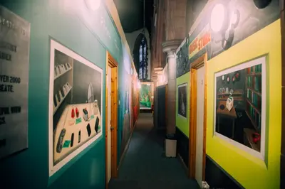 a hallway in a building with paintings on the walls at Belford Hostel in Edinburgh