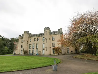 an old castle with a trash can in front of it at Gate Lodge, House of Binns in Linlithgow