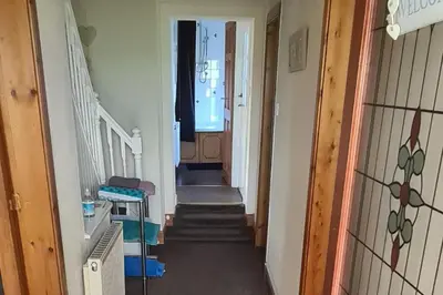 a hallway with stairs leading to a room at 4 Bed Cottage Sleeps 6-Pet-Friendly-Private Garden in Campbeltown