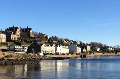 a town on the shore of a river with houses at Loch Views Apartment Sleeps 2-Pets Ok-Free Parking in Campbeltown