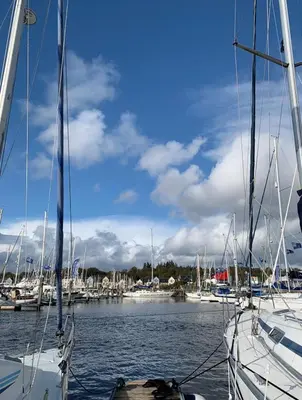 a group of boats docked in a harbor at The Wee Shop, Stylish Two Bed Flat in Inverkip Village in Inverkip