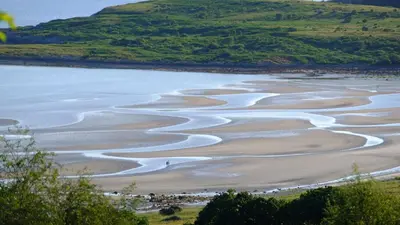 a view of the beach from a hill at Tighnabruaich Duplex Apartment - Sea Views in Tighnabruaich