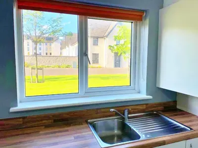 a kitchen with a sink and a window at Newbuild - 3 bedrooms, 2 baths,5 mins from airport in Edinburgh