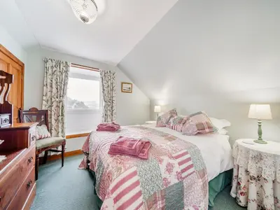a bedroom with a bed and a window at The Stables - Uk37415 in Bunessan