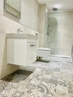a bathroom with a sink and a shower at DESIGNER HOUSE - University of Glasgow / Central Glasgow 'Hillhead' West End G12 - Luxurious & Contemporary Detached House / Terrace / Garden / 'electric car charging' Garage Parking in Glasgow