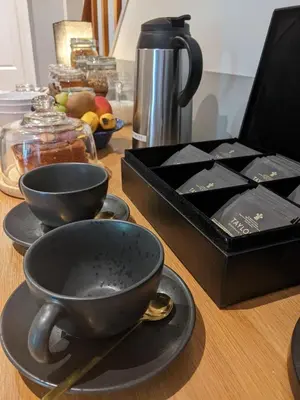 a table with two black cups and a black box at Ronachan in Clachan