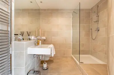 a bathroom with a sink and a shower at Exclusive 2 Bed, Free Private Parking, in West End in Edinburgh