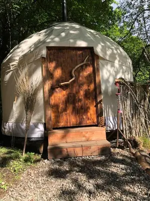 an outside door of a yurt with a wooden door at The Loveshack Lodge Balquhidder in Balquhidder