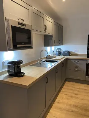 a kitchen with a sink and a counter top at White Cottage - Cosy Holiday Cottage in Drymen, Loch Lomond & Trossachs in Drymen