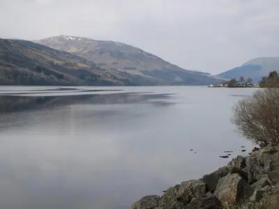a view of a lake with mountains in the background at Red Kite Lodge in Crieff