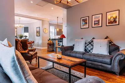a living room with two couches and a coffee table at Stylish Loch Lomond lodge in stunning surroundings in Balloch