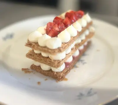a stack of waffles with marshmallows and strawberries on a plate at Callander Meadows in Callander