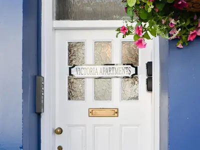 a white door with a sign on it at Cairnsmore - Uk34533 in Newton Stewart