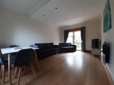 a living room with a couch and a table at Carvetii - Xavier House - 2-storey sleeps up to 7 in Rosyth