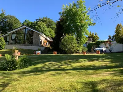 a house in a yard with a large lawn at Havenwood in Ayr