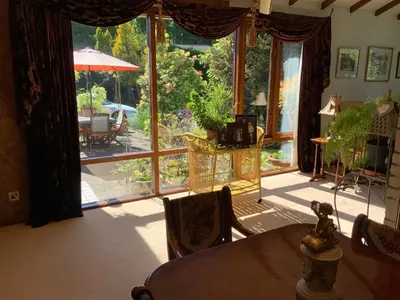 a dining room with a table and a large window at Havenwood in Ayr