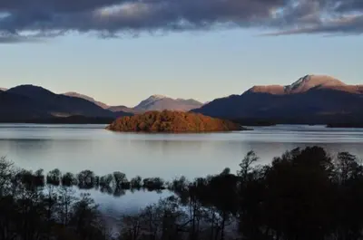 an island in the middle of a large body of water at The Old Farmhouse in Balloch