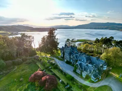 an aerial view of a house with a lake at Achnacloich in Achnacloich