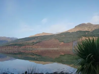a view of a lake with mountains in the background at Arrochar Fern Cottage with Wood Burner & Loch View in Arrochar