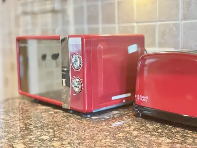 a red toaster sitting on top of a counter at Clyde Villa in Glasgow