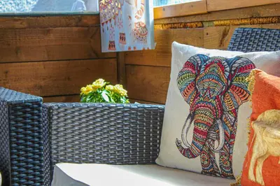 a pillow with an elephant on it sitting on a table at Lotus Studio near Lanark in Carstairs
