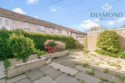 a garden in front of a building at Grangemouth, 3 Bed House, Free Parking, Business or Leisure in Grangemouth